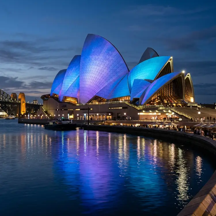 Sydney Opera House illuminated blue at night